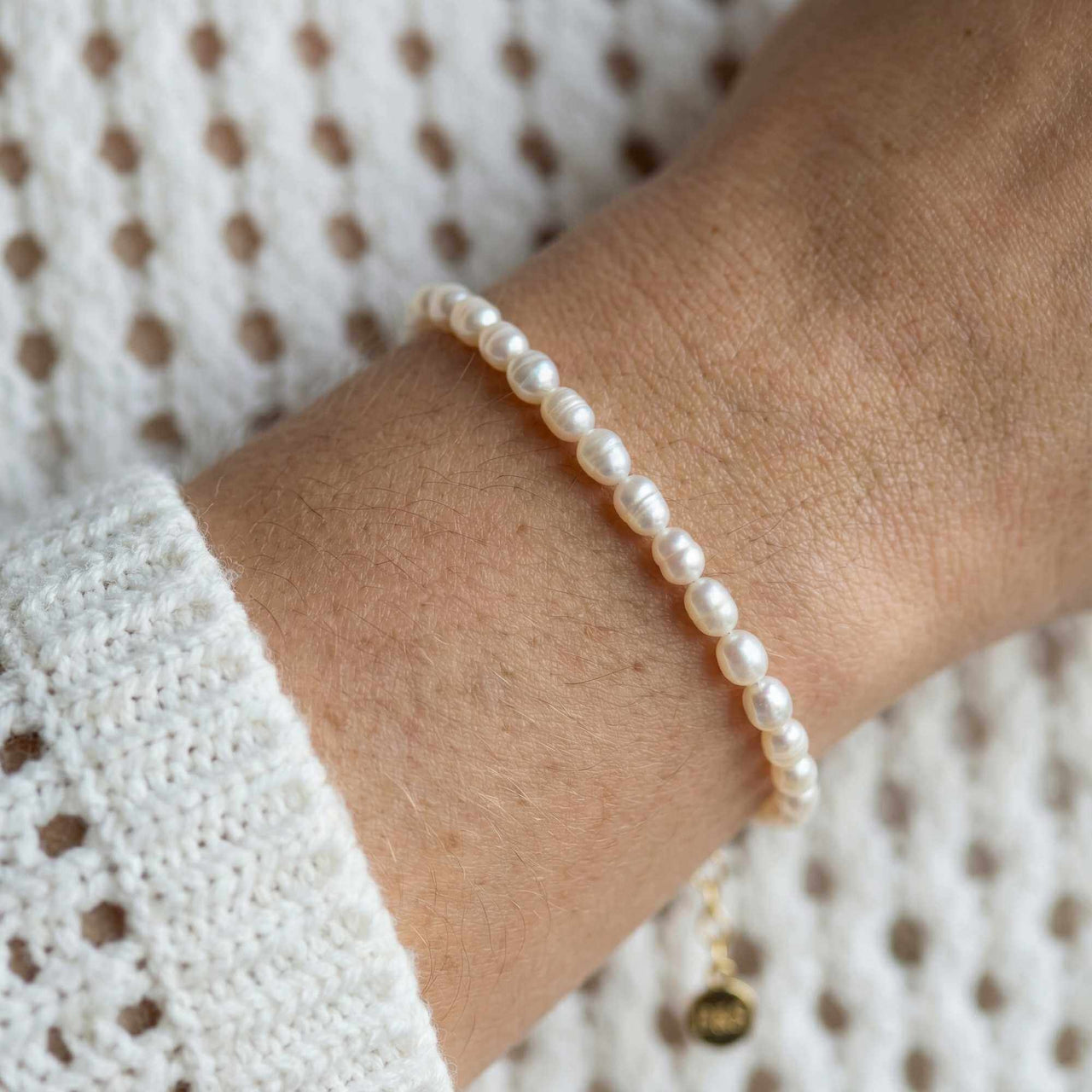 Freshwater Pearl Bracelet by Brother & Sisters featuring unique, handcrafted pearls on a wrist.