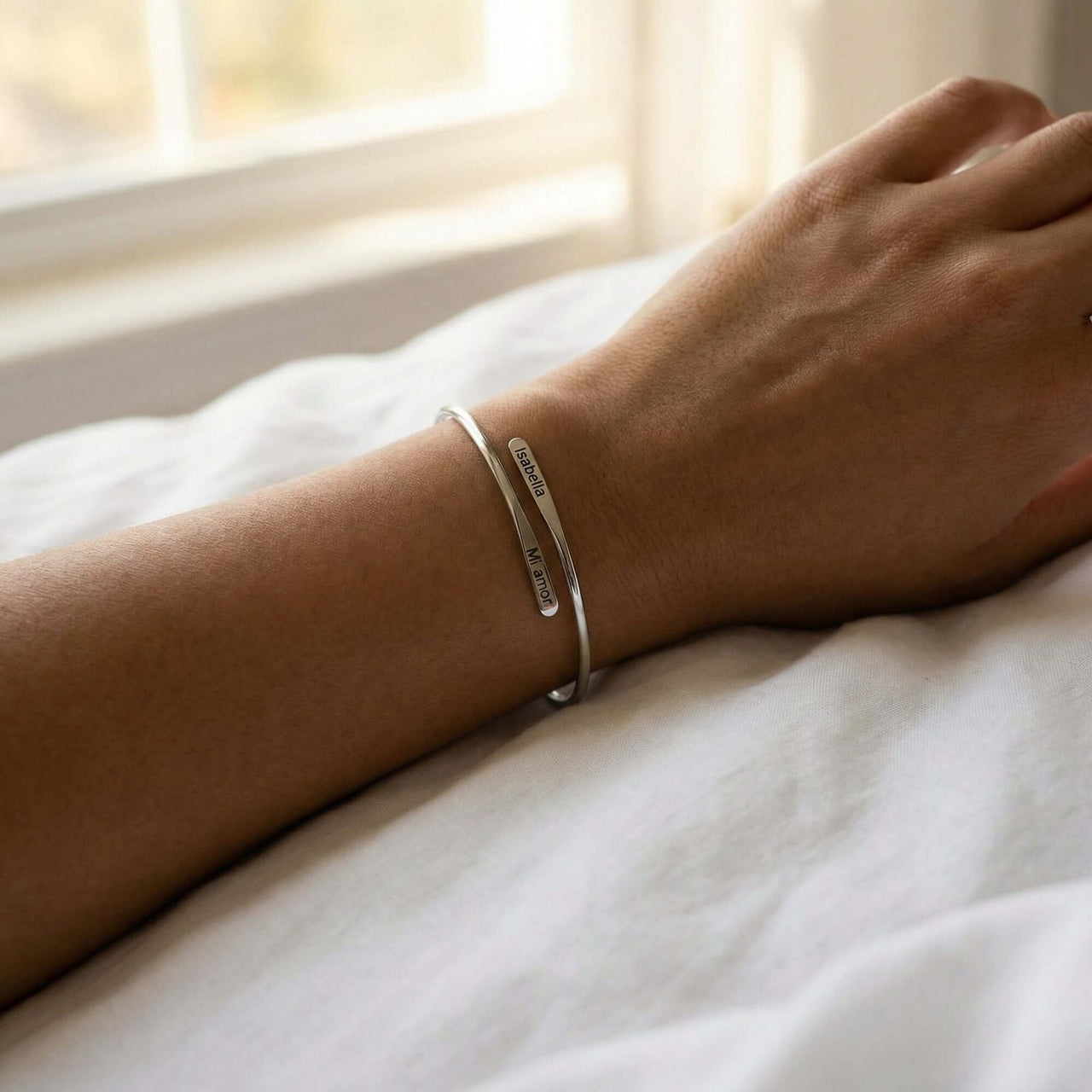 Wrap Couple Bracelet by Brother & Sisters worn on wrist, featuring custom engravings for couples.
