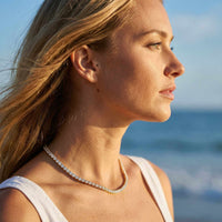 Thumbnail for Isolde Tennis Necklace worn by a model, featuring diamond simulants set in 18K gold, by Brother & Sisters.