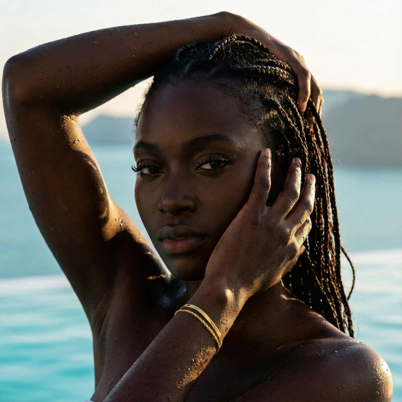 Ios Layered Bracelet worn by a model with braided hair by Brother & Sisters, highlighting its effortless outdoor style.