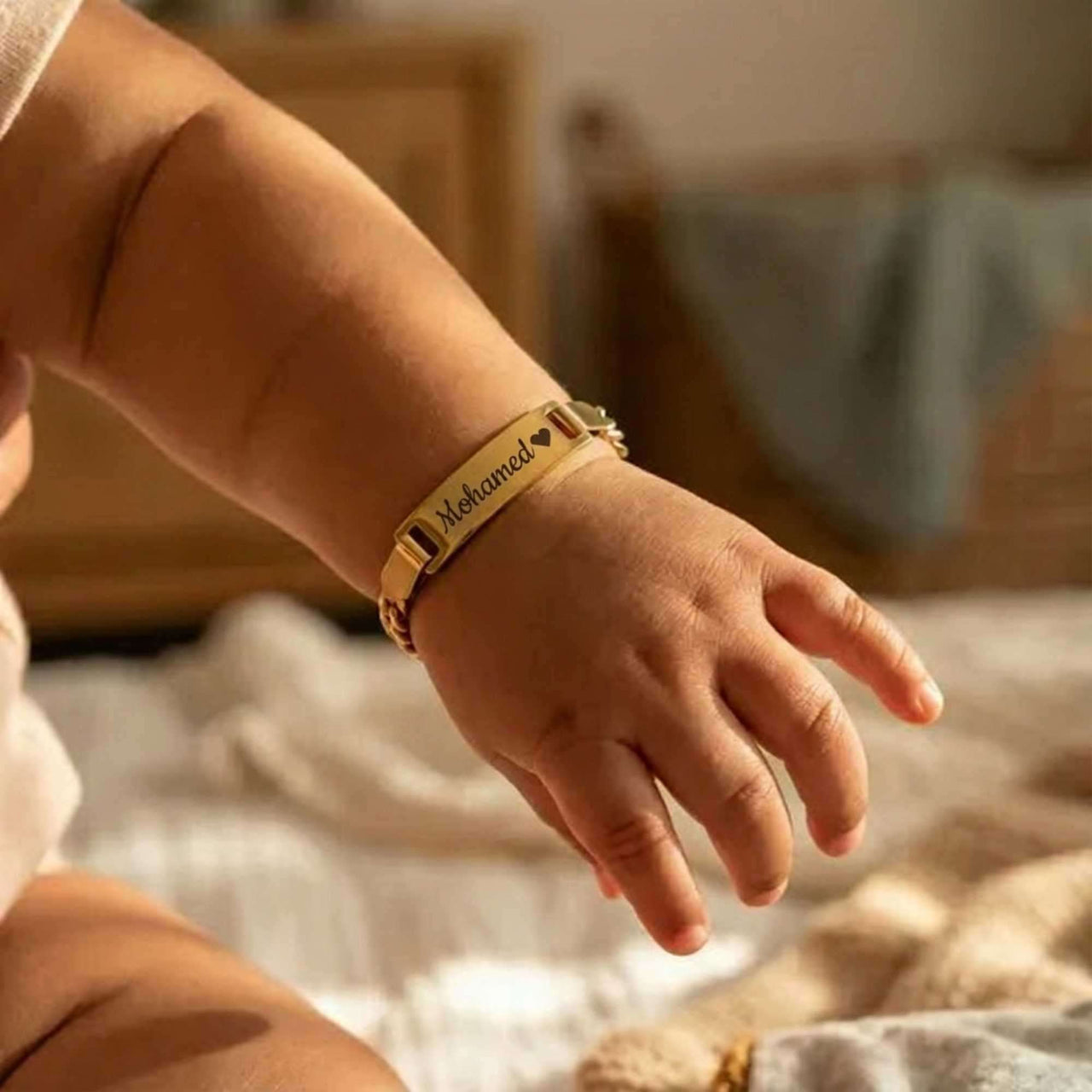 Infant Bracelet personalized with the name Mohamed, crafted by Brother & Sisters for a precious keepsake.