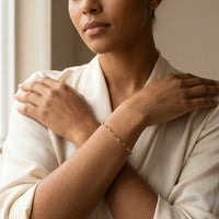 Thumbnail for Model wearing Paperclip Chain Bracelet by Brother & Sisters, showcasing its simple links and elegant style.