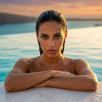 Thumbnail for White Beaded Choker showcased on a model by Brother & Sisters, with a stunning sunset background.