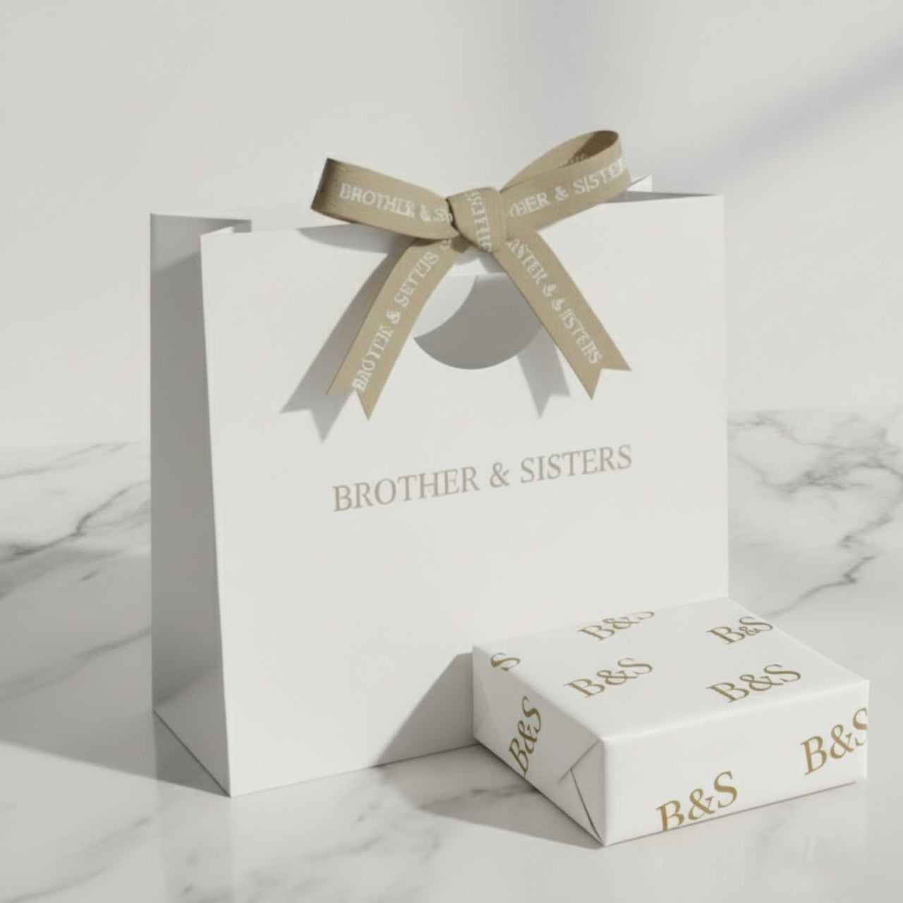 Elegant gift wrapping & bag by Brother & Sisters, featuring refined design and a stylish bow, perfect for every occasion.