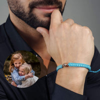 Thumbnail for Man Blue Photo Bracelet worn by a man, featuring a circular pendant with a photo, designed by Brother & Sisters.
