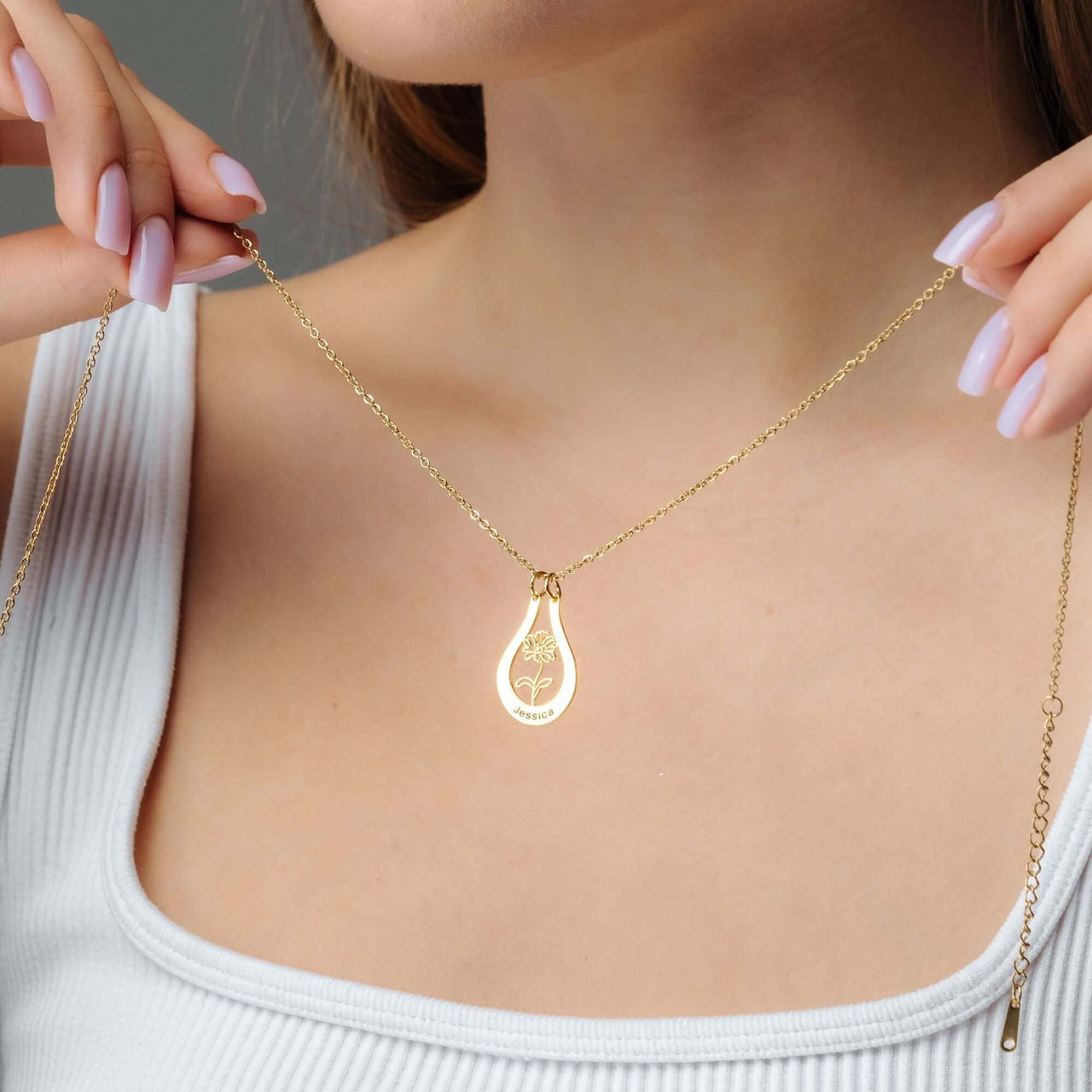Birth Flower Name Necklace by Brother & Sisters, showcasing a personalized gold pendant with floral design.
