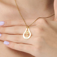 Thumbnail for Birth Flower Name Necklace by Brother & Sisters worn on a hand with the name 'Laura' and engraved flower design.