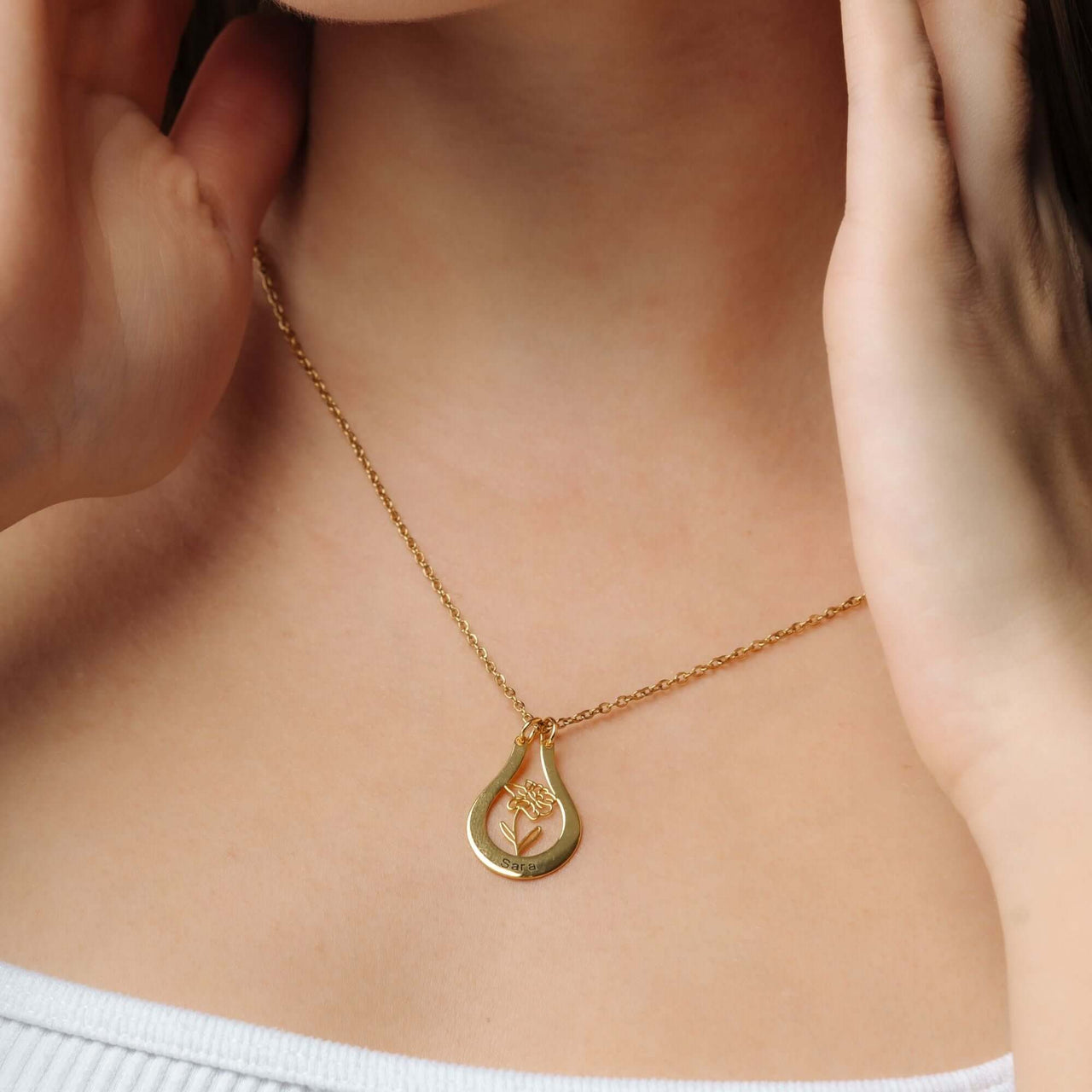 Birth Flower Name Necklace from Brother & Sisters, showcasing a gold pendant with flower design on a gold chain.