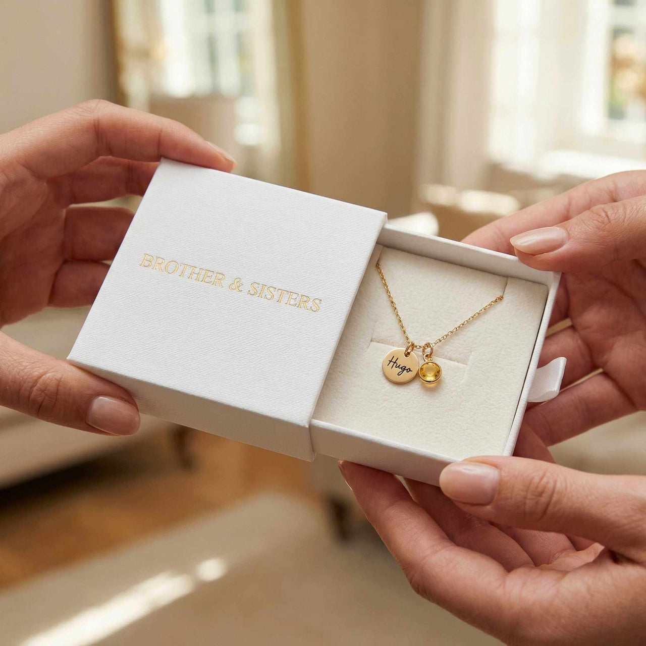 Precious Name Necklace presented in gift box by Brother & Sisters, featuring a personalized name pendant and birthstone crystal.