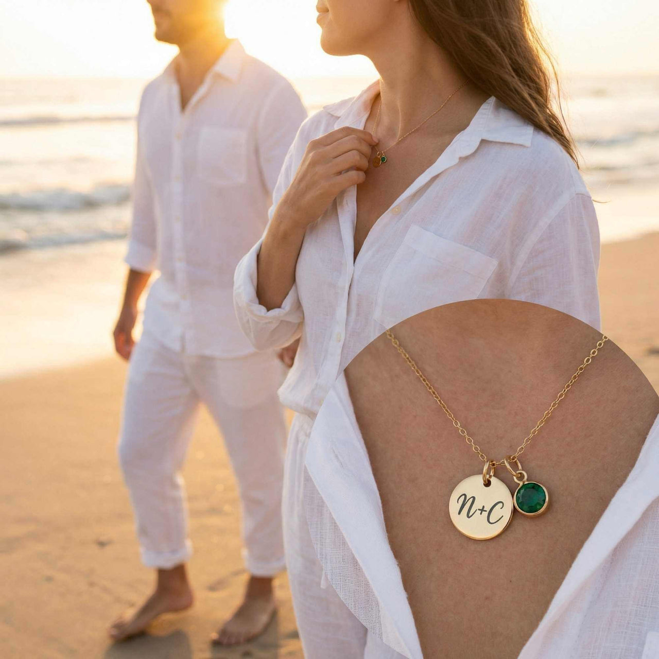 Precious Name Necklace worn by a couple on the beach, featuring engraved initials and a birthstone crystal, by Brother & Sisters.