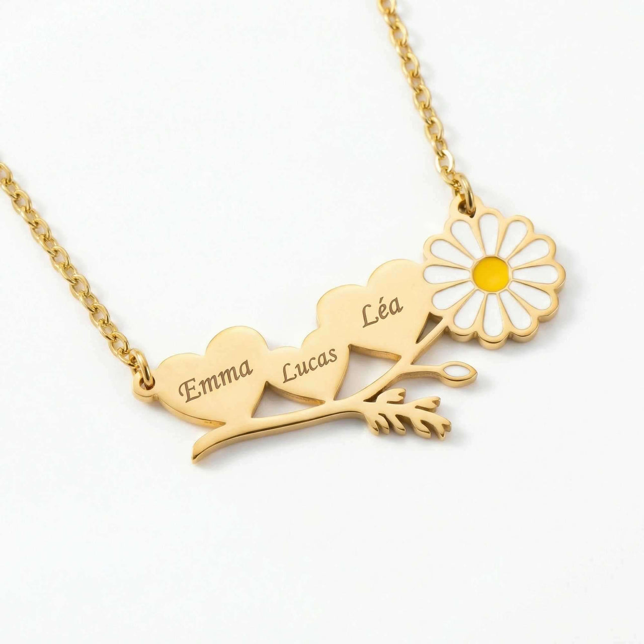 Daisy Name Necklace by Brother & Sisters featuring hearts and a white enamel daisy, engraved with names Emma, Lucas, and Léa.