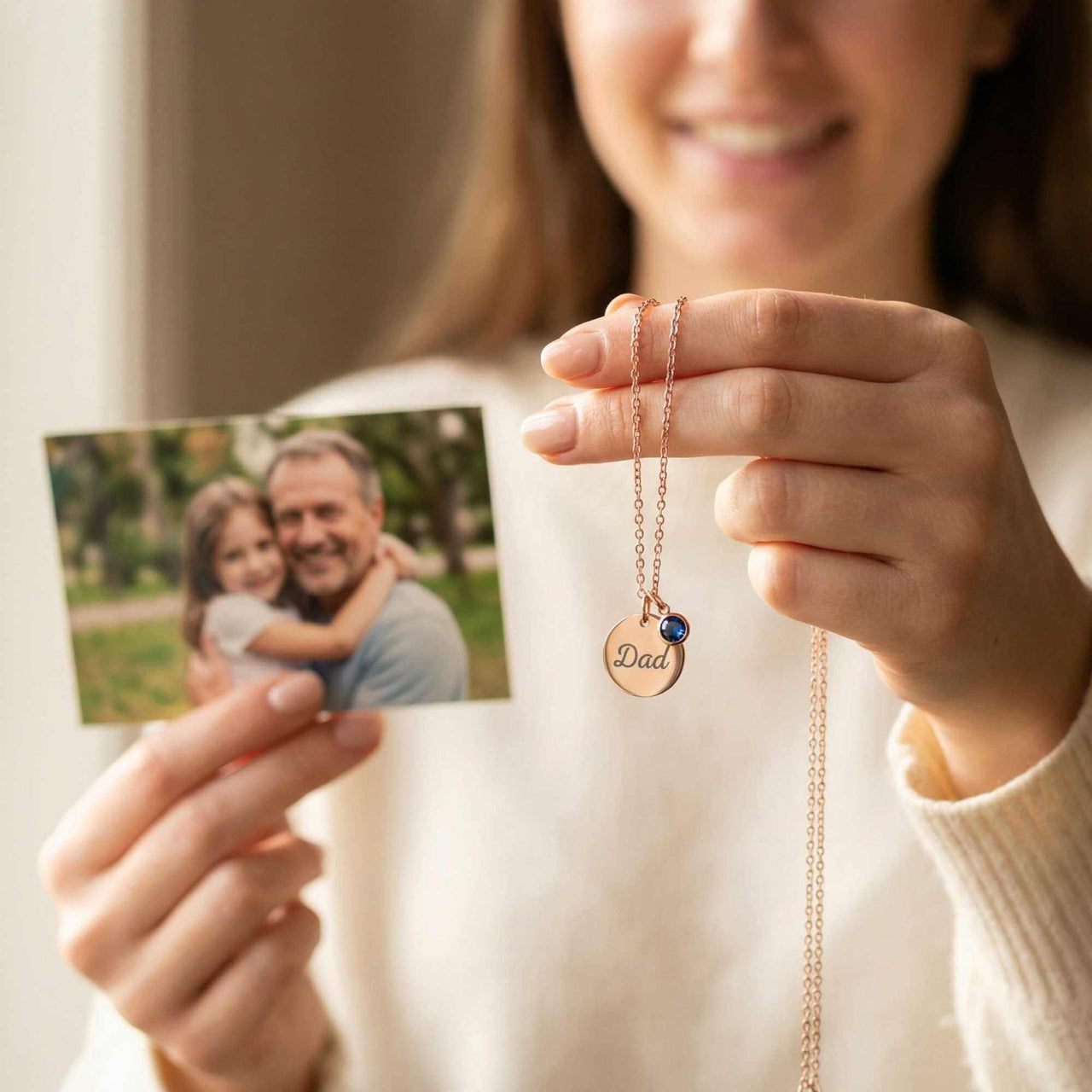 Precious Name Necklace held by a woman featuring 'Dad', showcasing personalized jewelry from Brother & Sisters.