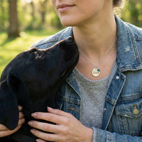 Thumbnail for Woman wearing Precious Name Necklace with engraved name 'Luna' and birthstone, enjoying time with her dog.
