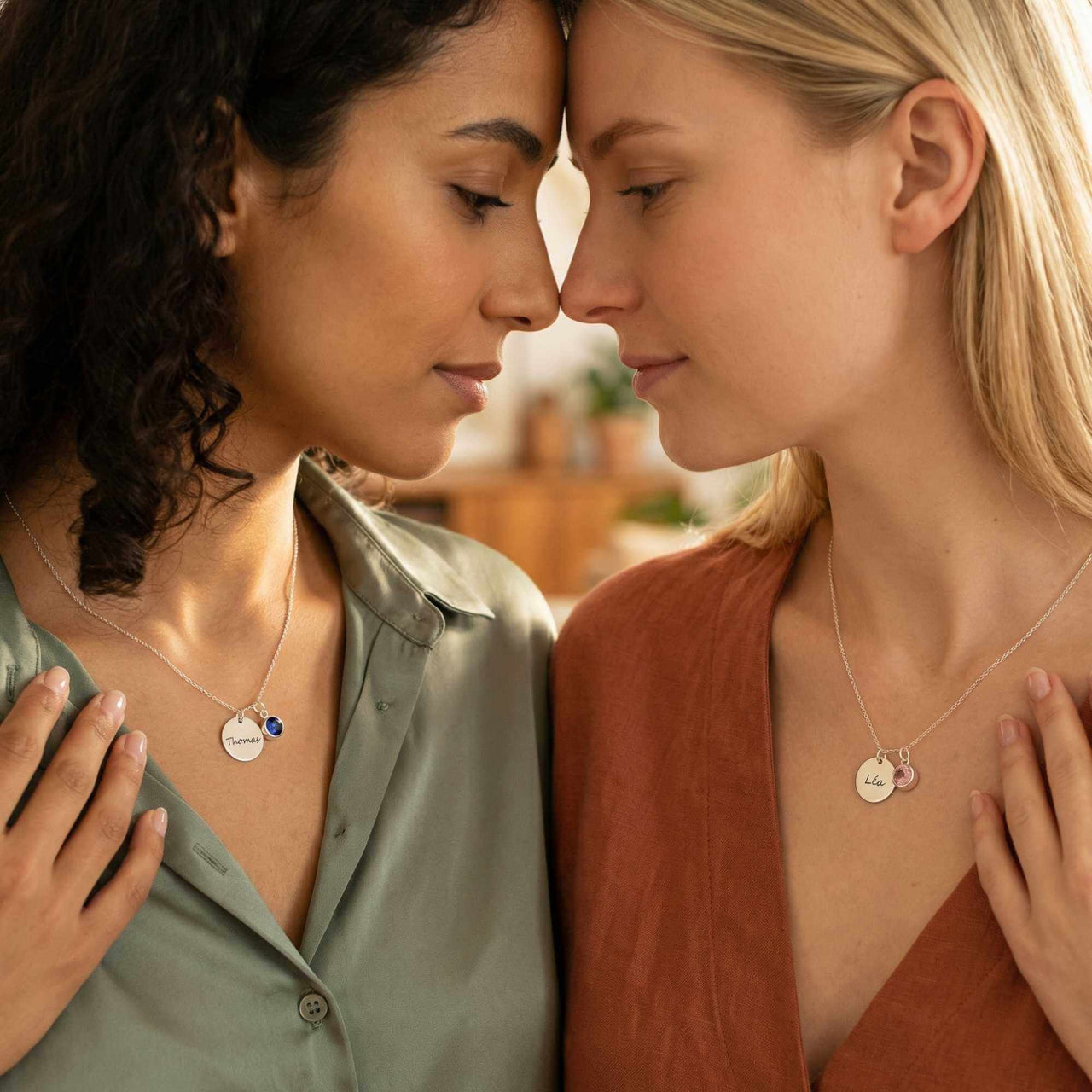 Precious Name Necklace worn by two women, showcasing personalized name and birthstone details, by Brother & Sisters.