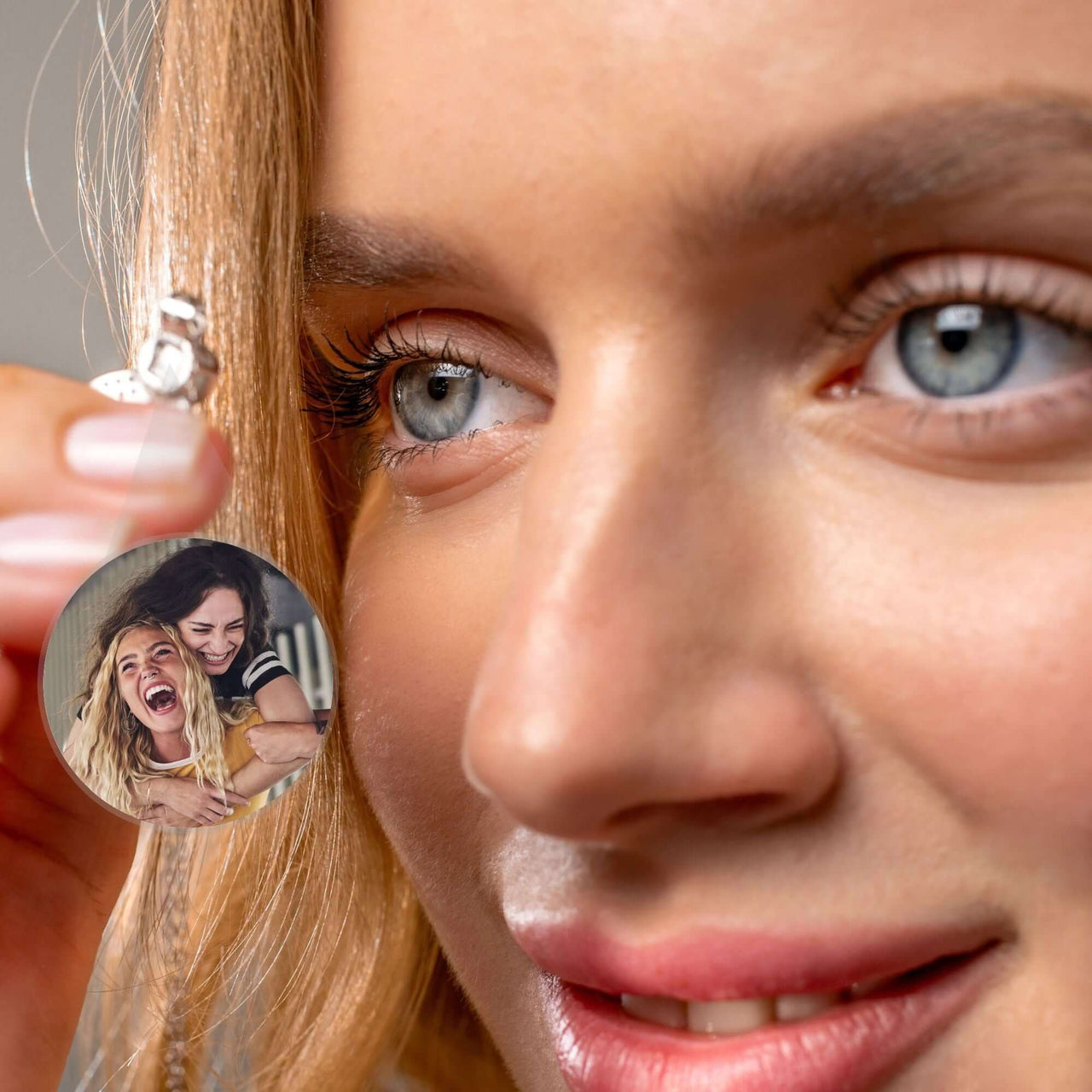 Angel Photo Necklace by Brother & Sisters featuring a woman holding a pendant displaying a cherished photo.