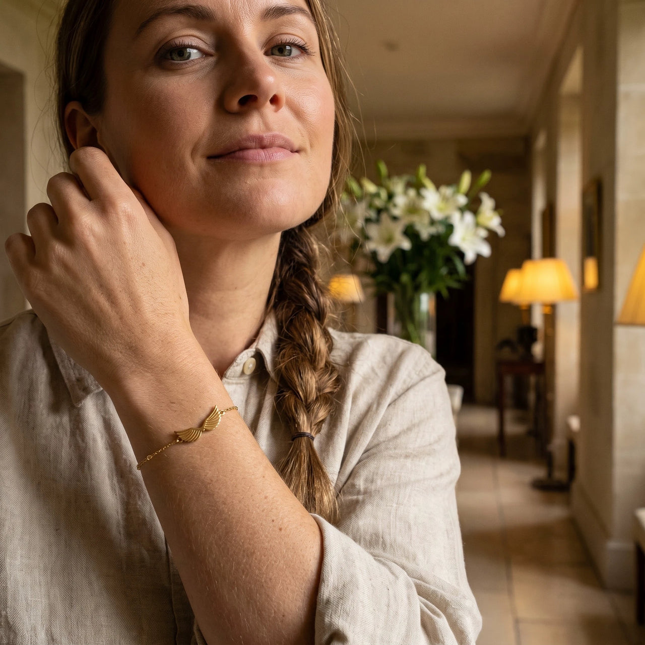 Profile view of a woman wearing the gold bracelet | SKU: 42006-gold