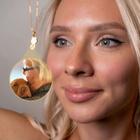 Thumbnail for Woman wearing an Animal Photo Necklace featuring her pet's photo, from Brother & Sisters, capturing cherished memories.