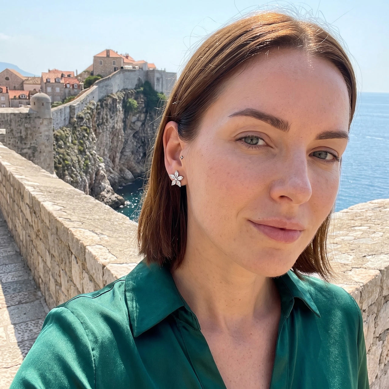 Austrian Crystals Flowers Earrings in silver worn on a getaway | SKU: 419620-silver
