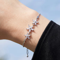 Thumbnail for Close-up of the Austrian Crystals Flowers bracelet in silver worn | SKU: 422177-white-gold-XS-S
