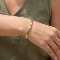 Thumbnail for Close-up of the Be The Unique Version Of Yourself bracelet in gold worn | SKU: btuvoy-g