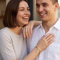 Thumbnail for Couple moment, she wears the Be The Unique Version Of Yourself bracelet in gold | SKU: btuvoy-g