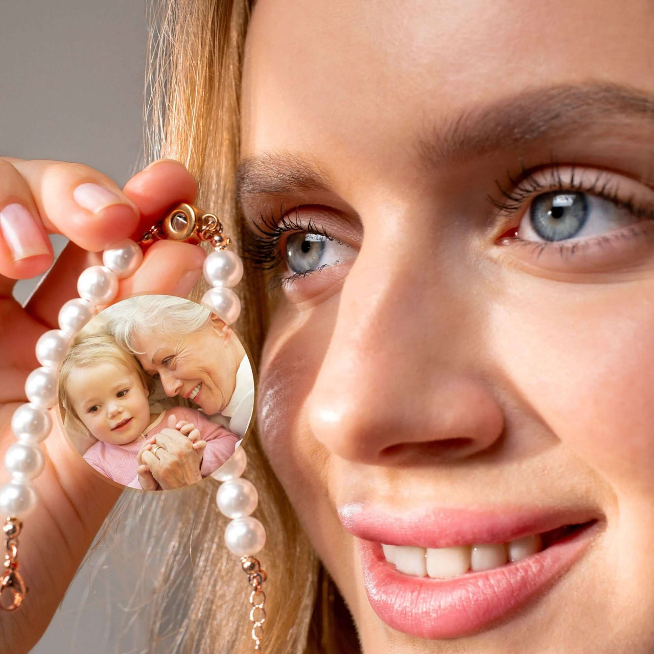 Beaded Photo Bracelet by Brother & Sisters featuring a woman holding a personalized photo charm of a cherished memory.