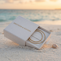 Thumbnail for Dainty Snake Anklet in Brother & Sisters gift box on beach