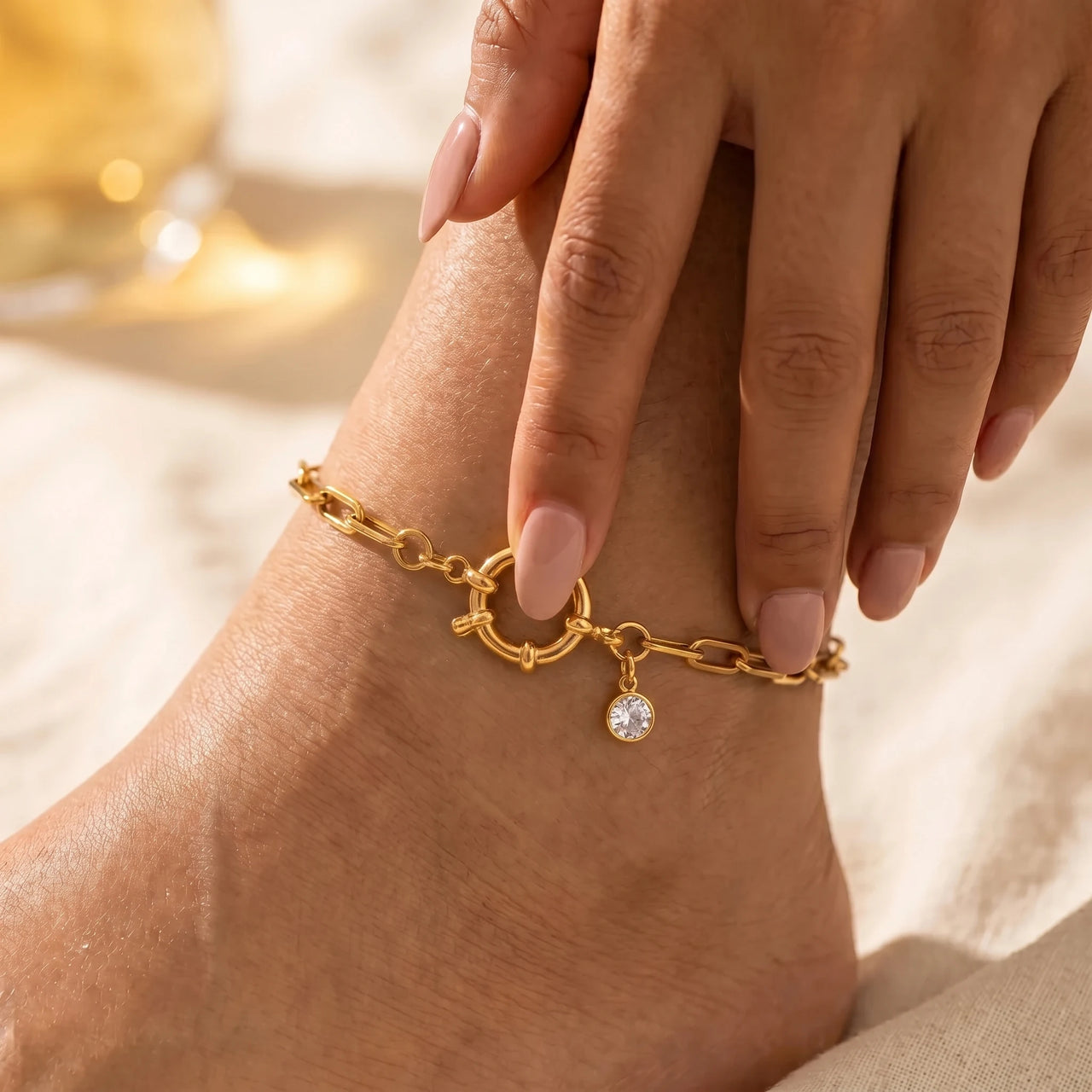 Brother and Sisters Carabiner Anklet design reference packshot — gold paperclip chain with nautical spring-ring clasp and round CZ