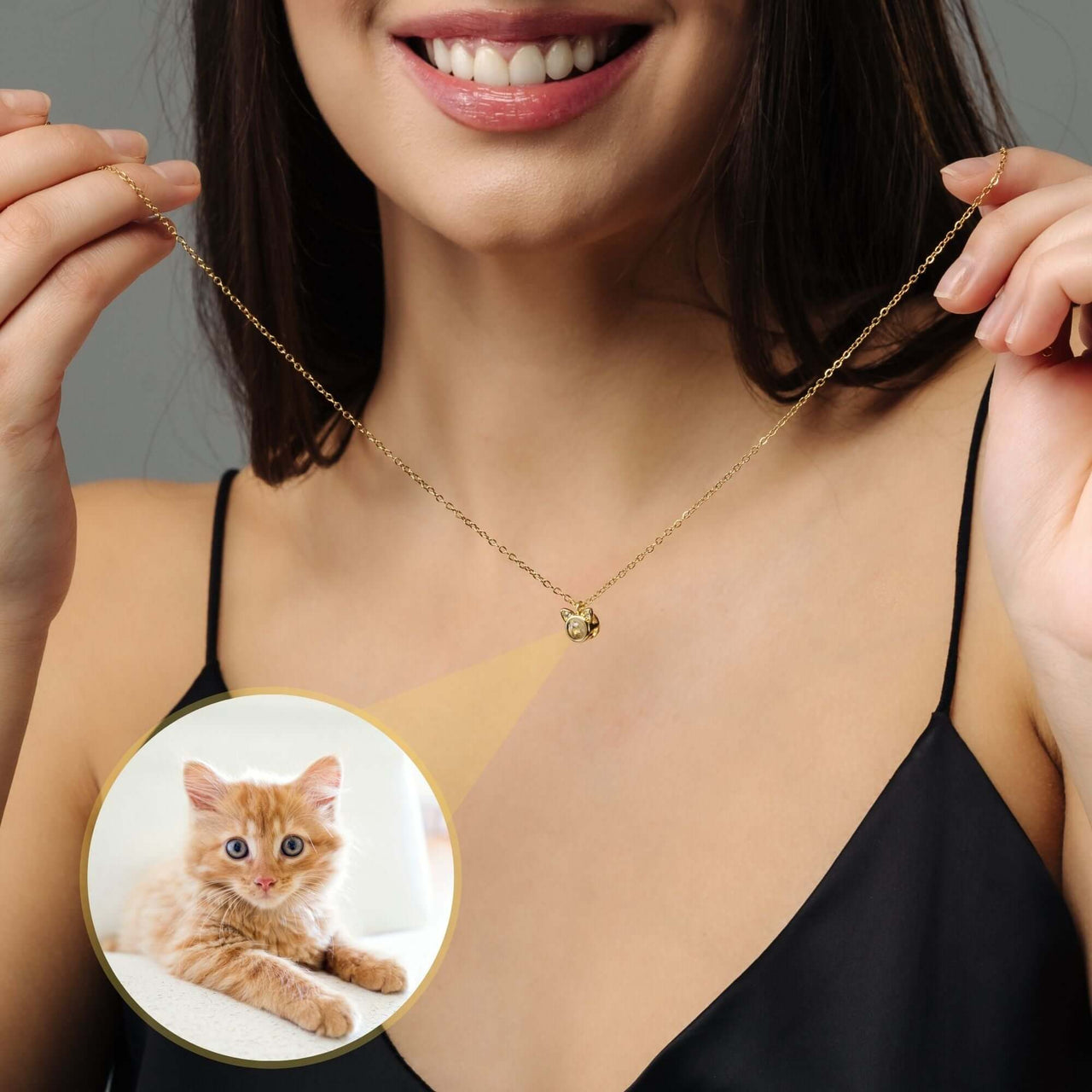 Cat Photo Necklace worn by a smiling woman, showcasing a hidden photo of her cat, from Brother & Sisters.
