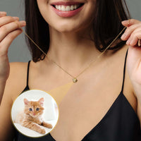 Thumbnail for Cat Photo Necklace worn by a smiling woman, showcasing a hidden photo of her cat, from Brother & Sisters.