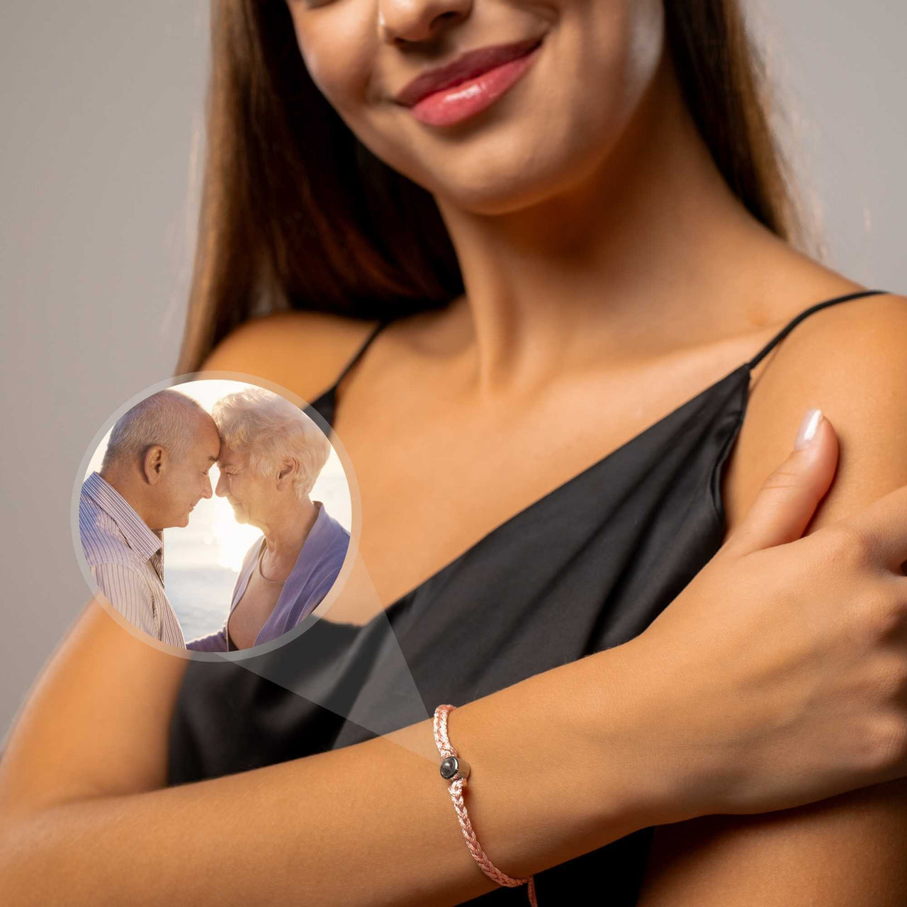 Pink Photo Bracelet showcasing a personalized photo pendant, worn by a woman to celebrate cherished memories.