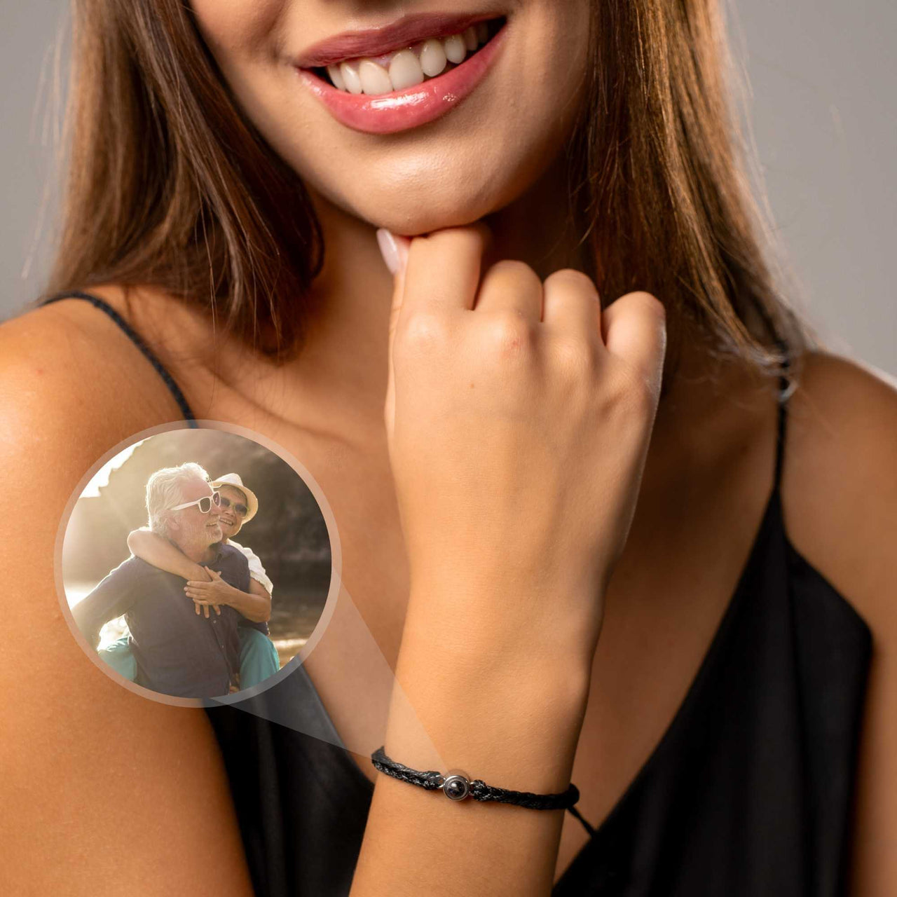 Black Photo Bracelet featuring a personalized circular pendant with a cherished photo, worn by a smiling woman.