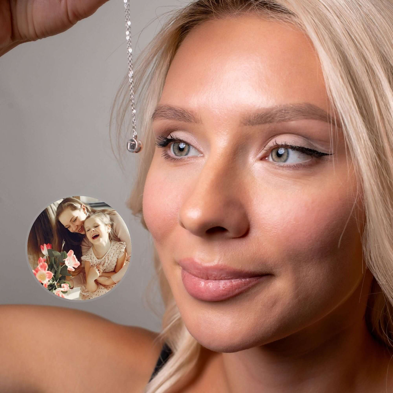 Woman showcasing the Circular Photo Bracelet by Brother & Sisters with a cherished photo charm.