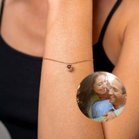 Thumbnail for Circular Photo Bracelet by Brother & Sisters showcasing memories with a sleek charm on a woman's wrist.