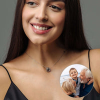 Thumbnail for Circular Photo Necklace worn by a woman showcasing a customizable photo projection pendant from Brother & Sisters.