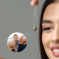 Thumbnail for Circular Photo Necklace held by a woman, showcasing a custom photo projection of loved ones inside the pendant, by Brother & Sisters.
