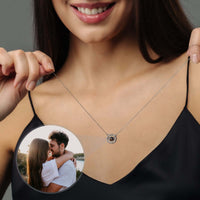 Thumbnail for Circular Photo Necklace worn by a woman showcasing a customisable photo projection from Brother & Sisters.