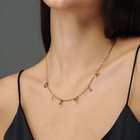Thumbnail for Classic Name Necklace in gold on a model, showcasing personalized letters by Brother & Sisters.