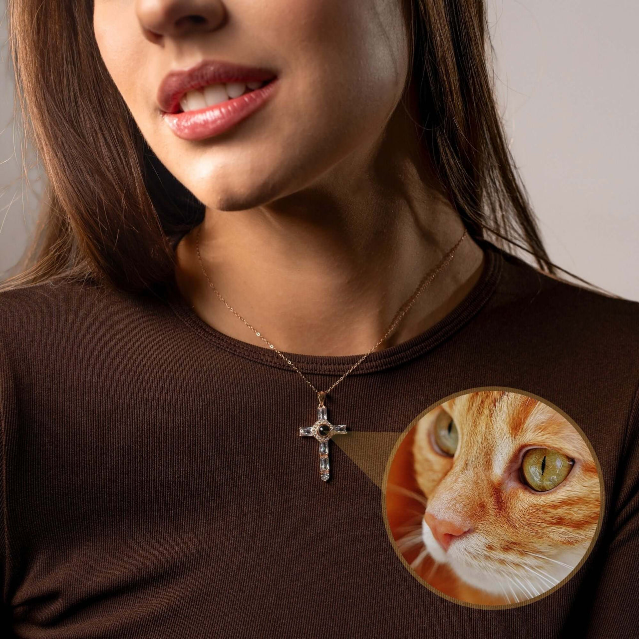 Cross Photo Necklace worn by a woman, featuring a customizable photo projection and cat image detail.
