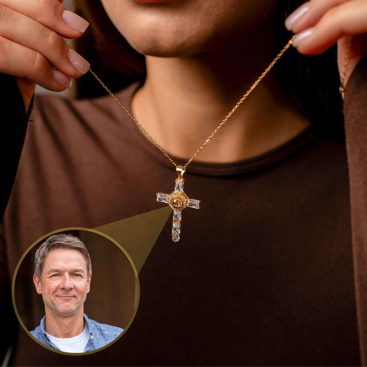 Cross Photo Necklace held by a woman, showcasing customizable photo projection, brand Brother & Sisters.