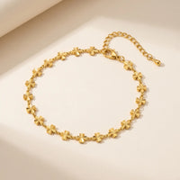 Thumbnail for Daisy Charm Anklet featuring 18K gold plated stainless steel with continuous chain of four-petal flowers by Brother & Sisters.