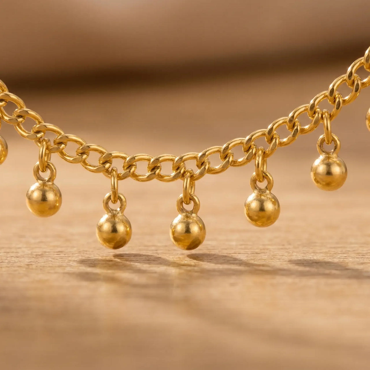 Drop Bead Anklet featuring shimmering gold beads on a fine cable chain by Brother & Sisters. Perfect for summer looks.