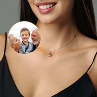 Thumbnail for Drop Photo Necklace worn by a woman, featuring a personalized pendant with a family photo. Crafted by Brother & Sisters.