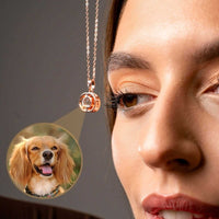 Thumbnail for Woman wearing a Duo Photo Necklace featuring a custom photo of a dog, showcasing the Brother & Sisters brand.