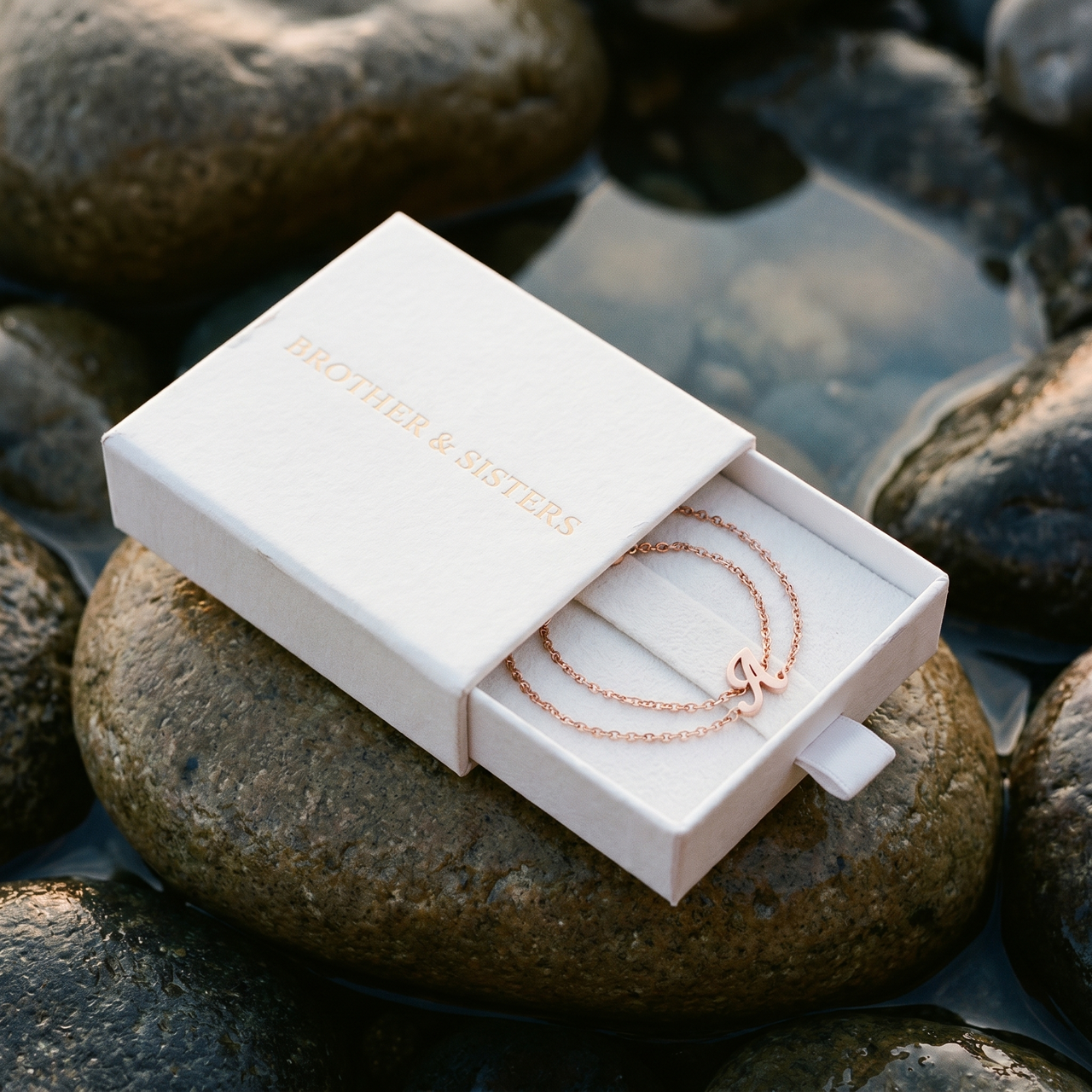 Engraved Letter Anklet rose gold in Brother & Sisters gift box on beach