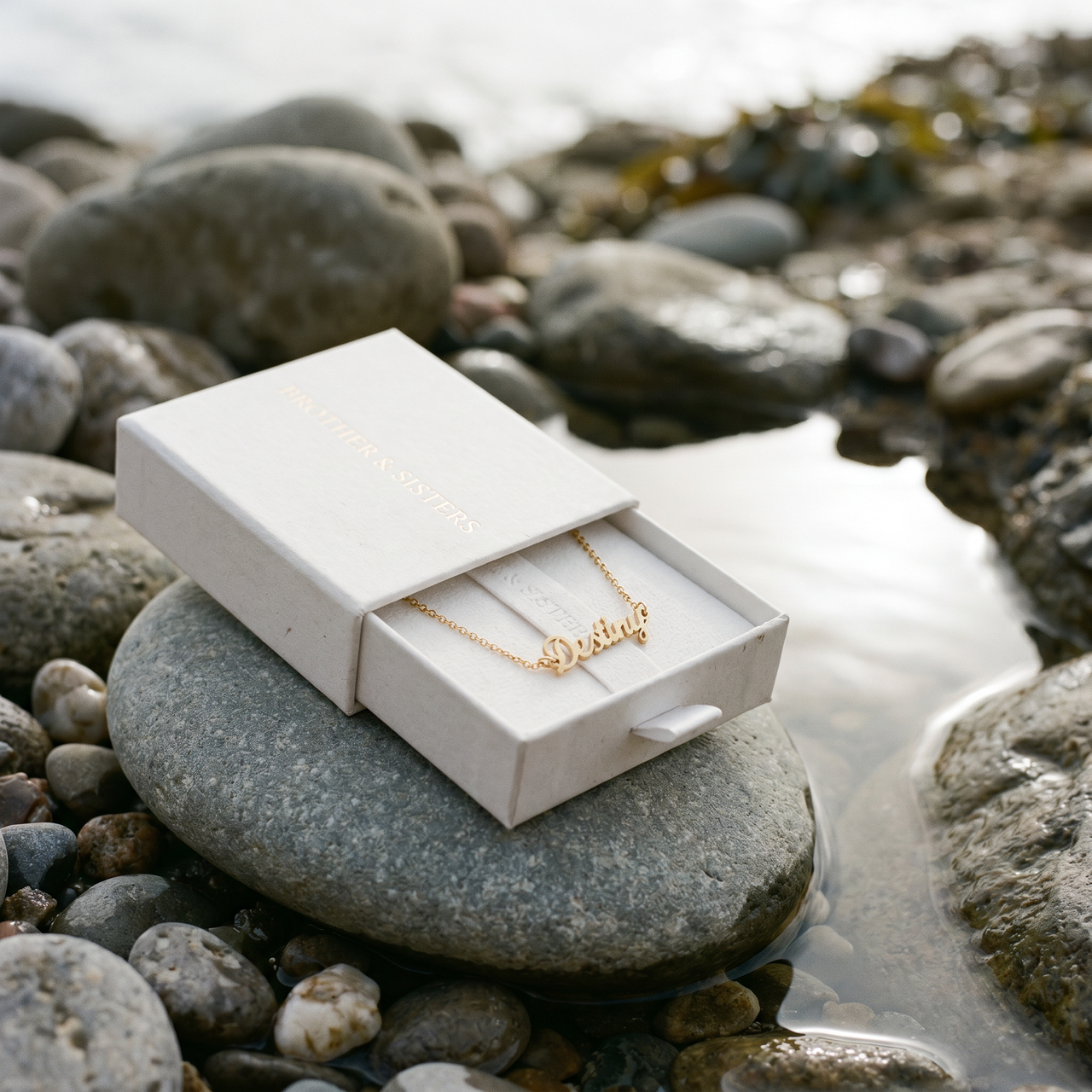Engraved Letter Anklet in Brother & Sisters gift box on beach