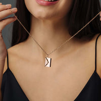 Thumbnail for Envelope Name Necklace by Brother & Sisters worn by a woman, showcasing a chic, modern design.
