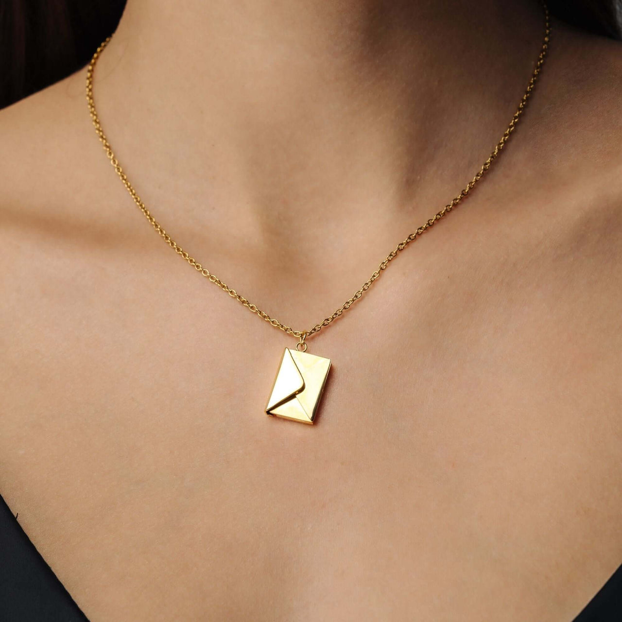 Envelope Name Necklace in gold with elegant design, a personalized jewelry piece by Brother & Sisters.