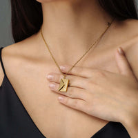 Thumbnail for Envelope Name Necklace by Brother & Sisters showcased on a woman's neck, highlighting its elegant design and personalization feature.