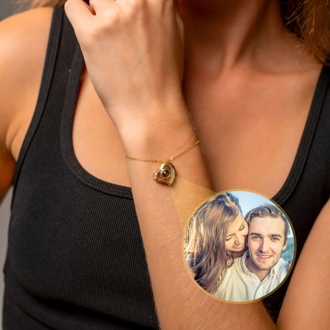 Family Photo Bracelet worn by a woman, featuring a heart pendant and a cherished couple's photo. Brand: Brother & Sisters.